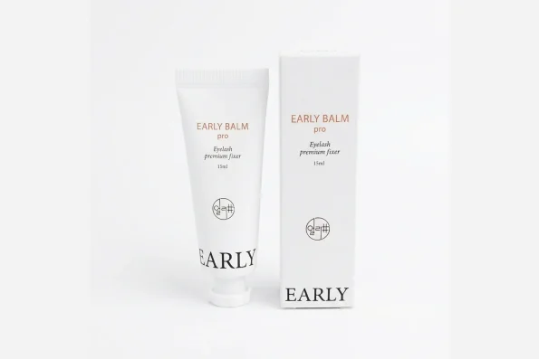 Lash lift balm tube with soft silicone lash lift rods and a flat lash brush