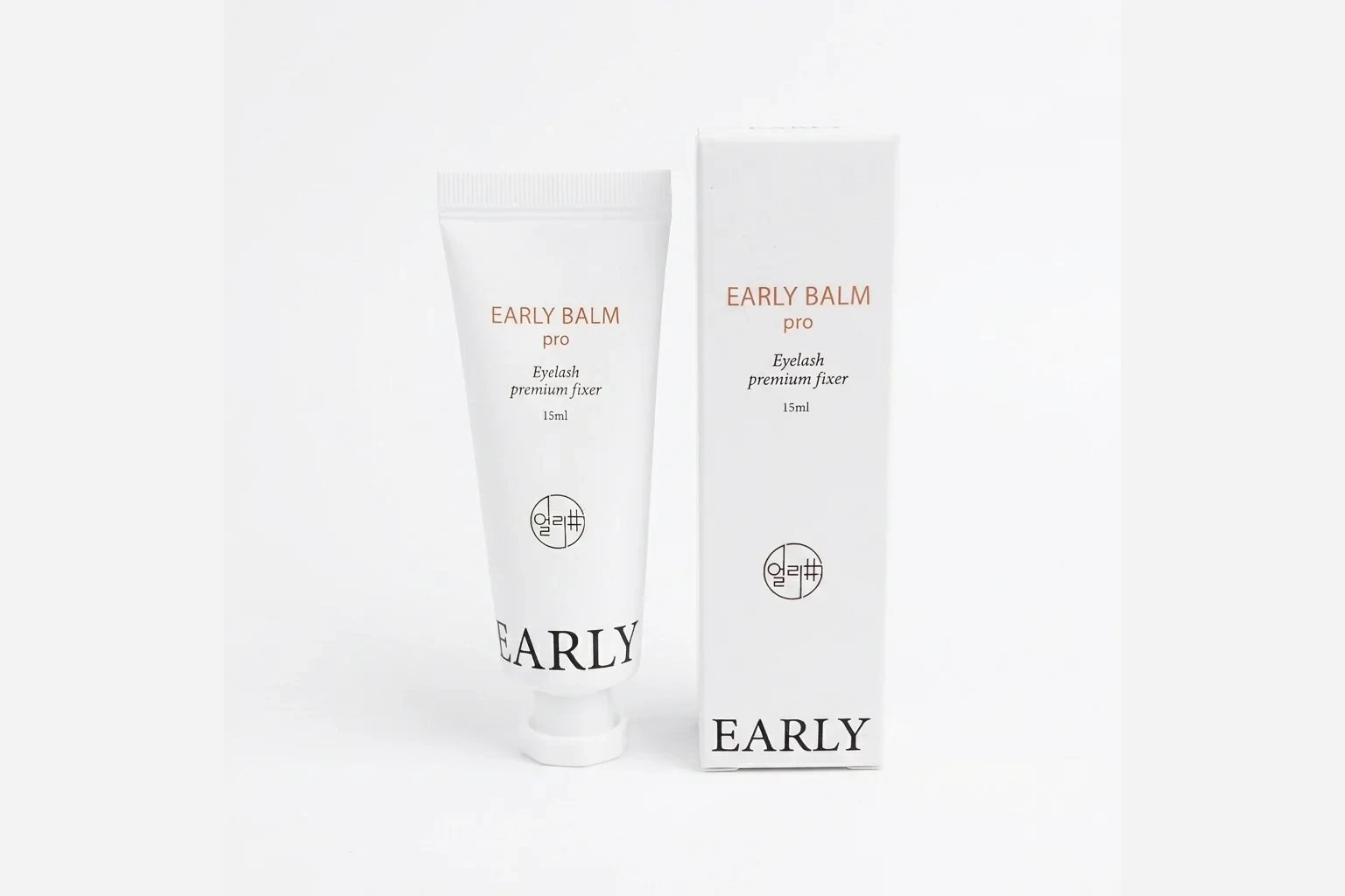 Lash lift balm tube with soft silicone lash lift rods and a flat lash brush
